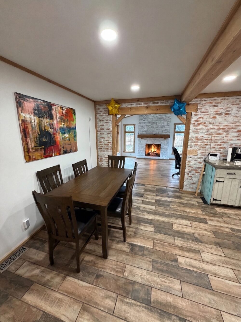 Warm, homelike living and dining area in a residential-style assisted living home