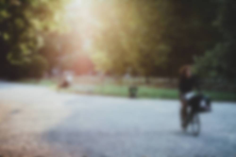 Older adult enjoying an outdoor trail on a warm day